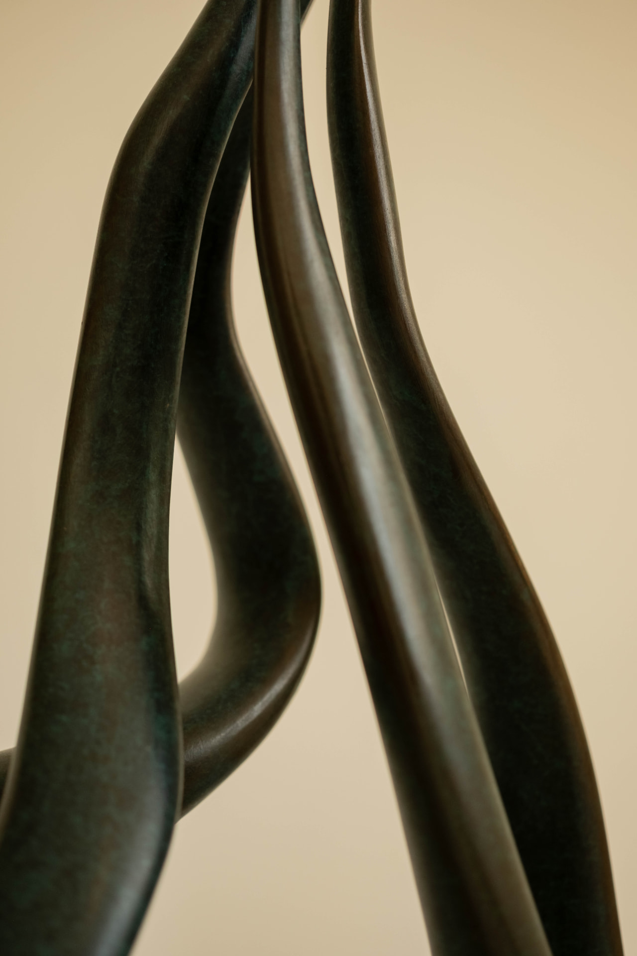 Ribbon — abstract bronze sculpture on a stone base