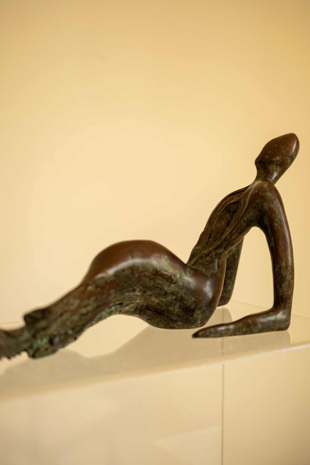 Repose, bronze sculpture