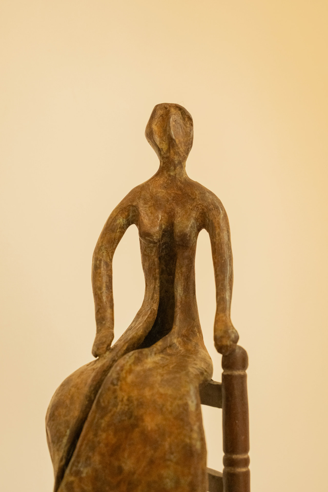 Woman in a Straw Chair, bronze sculpture
