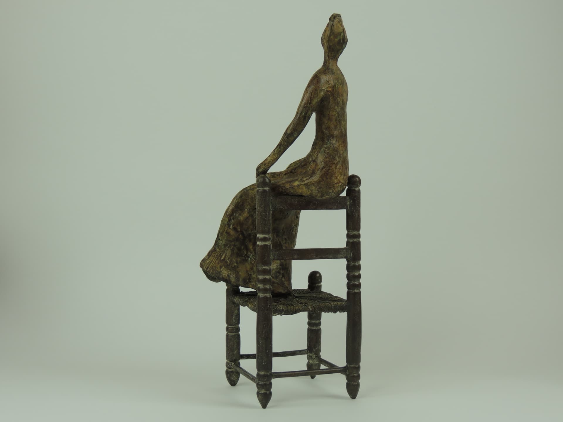 Woman on a Chair, bronze — side view