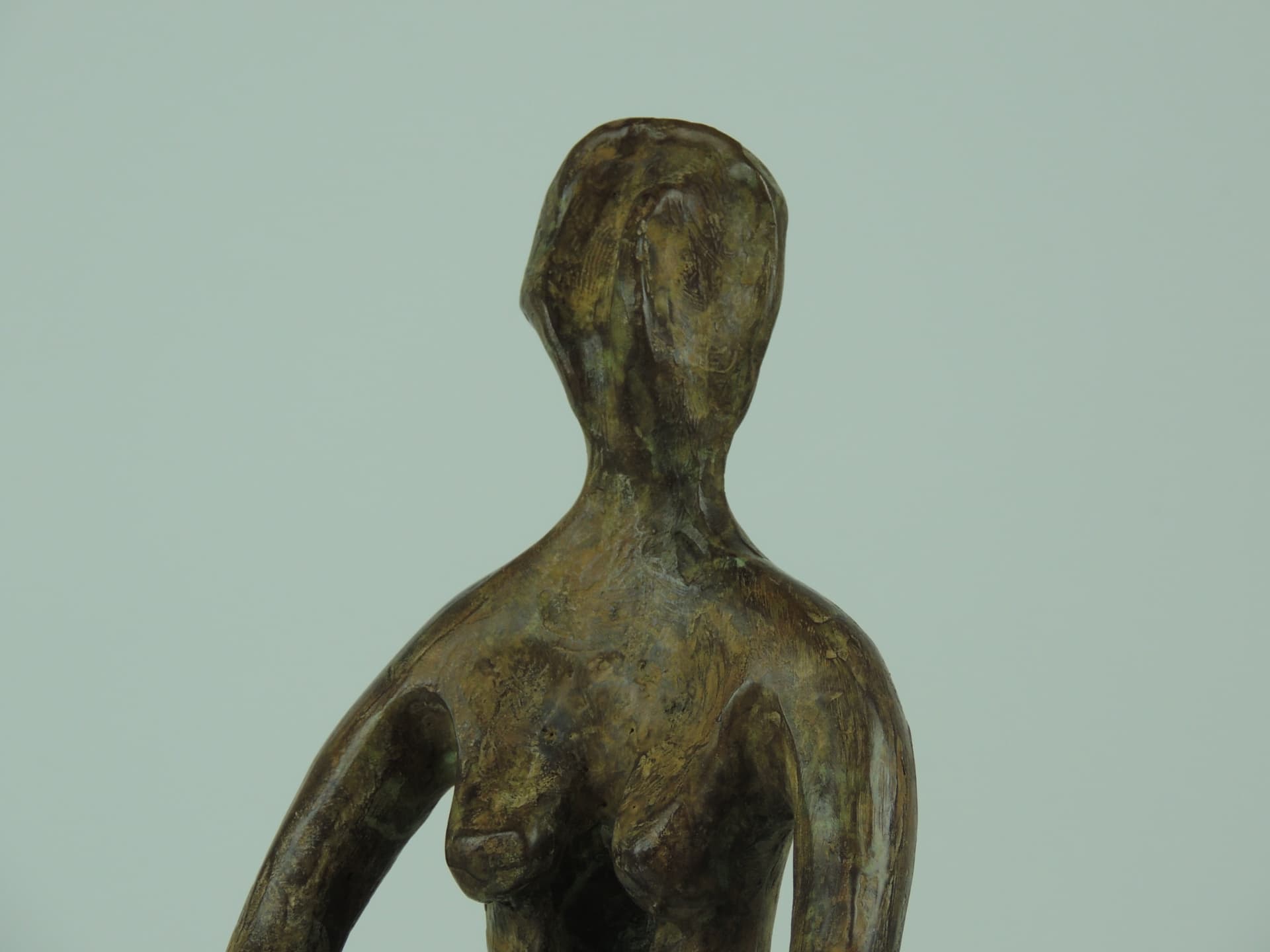 Woman on a Chair, bronze — detail of torso