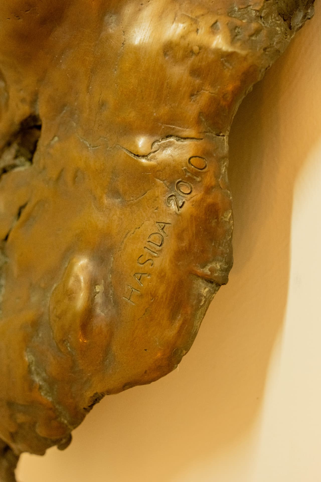 Torso Relief, wall-mounted bronze sculpture