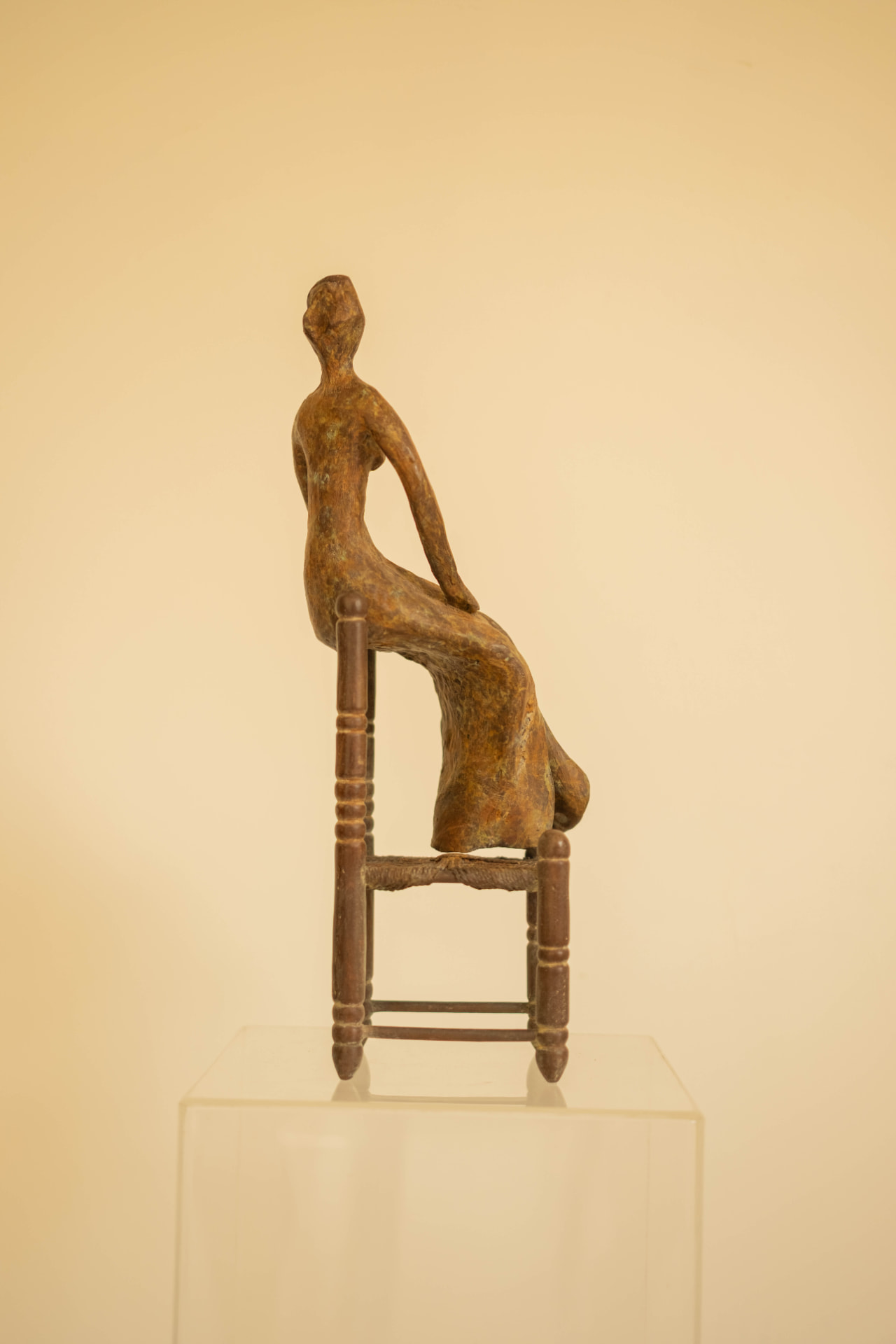 Woman in a Straw Chair, bronze sculpture