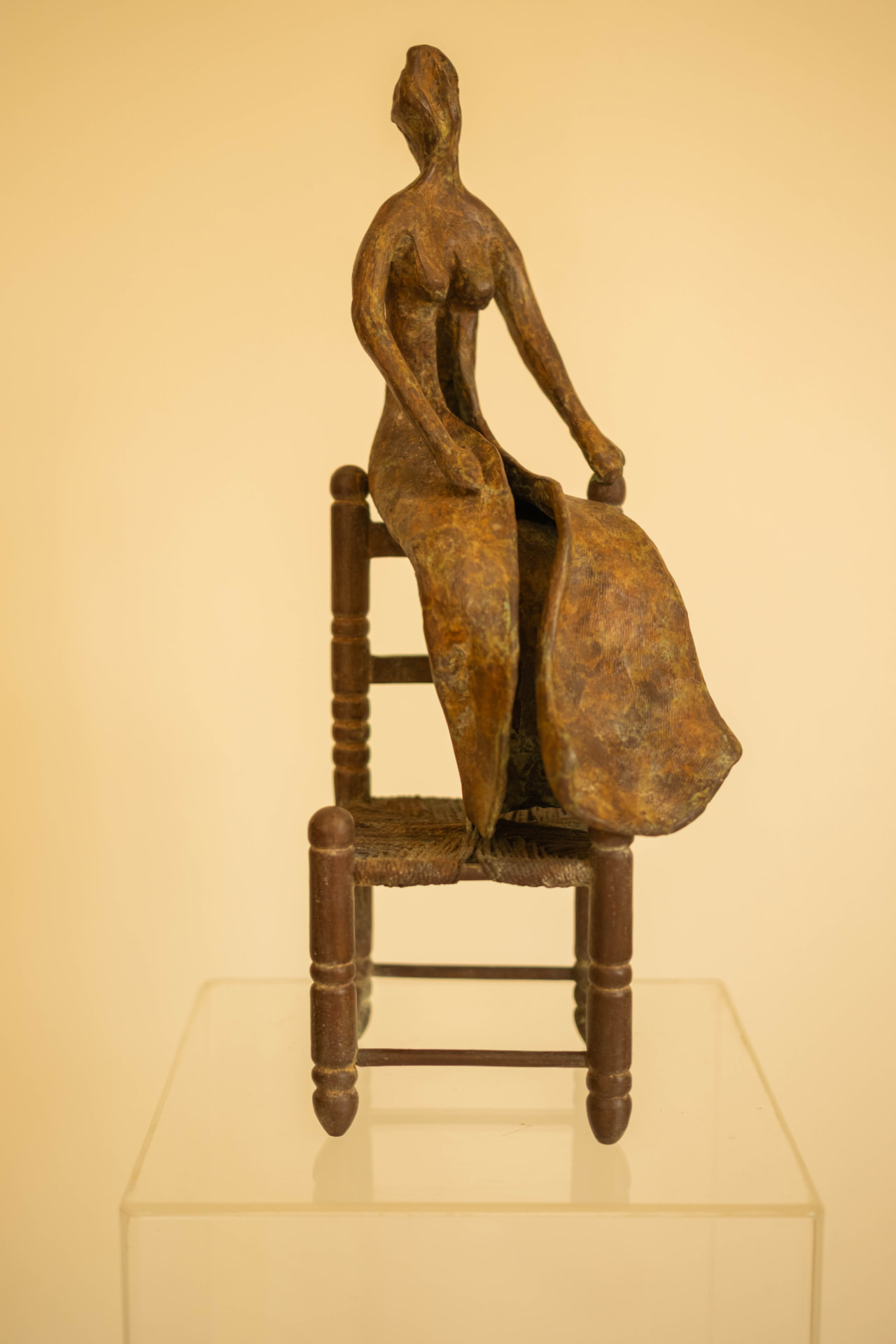 Woman in a Straw Chair, bronze sculpture