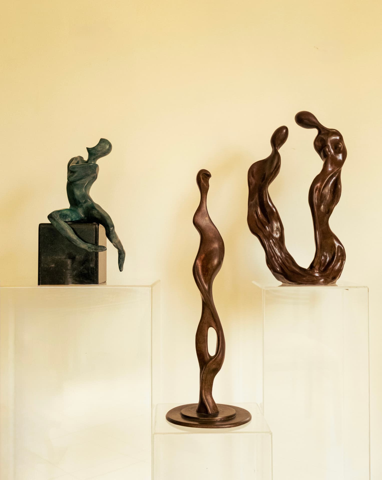Bronze sculptures by Hasida Steinbock grouped on plinths in the studio