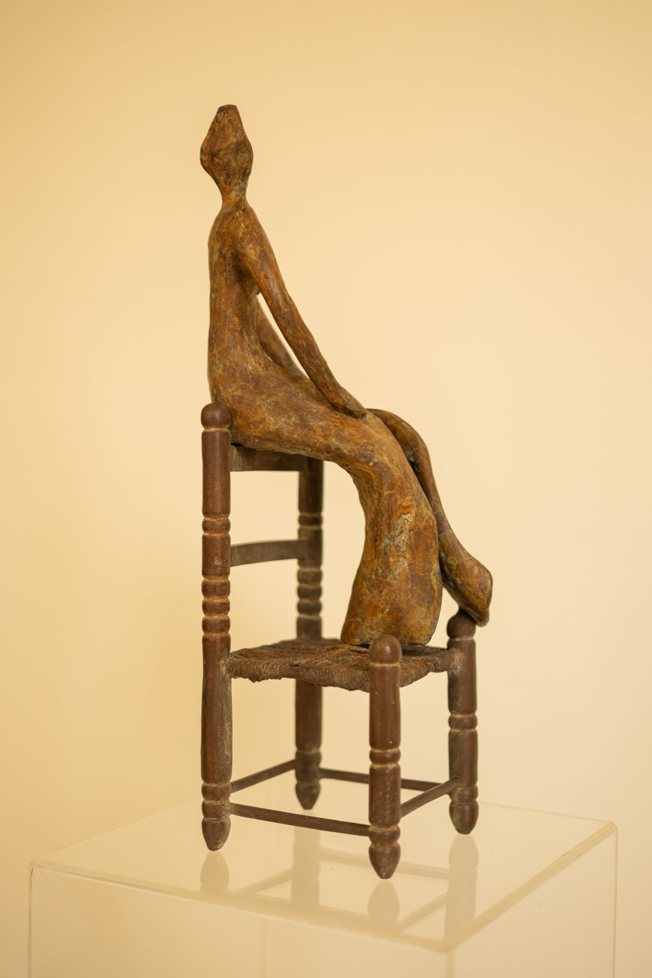 Woman in a Straw Chair, bronze sculpture